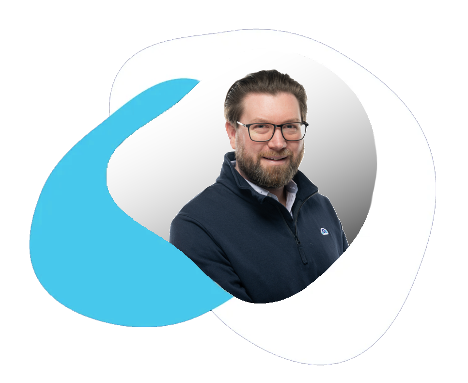 Owner and navy sweater smiles, inside a white circle with a blue swoosh graphic.