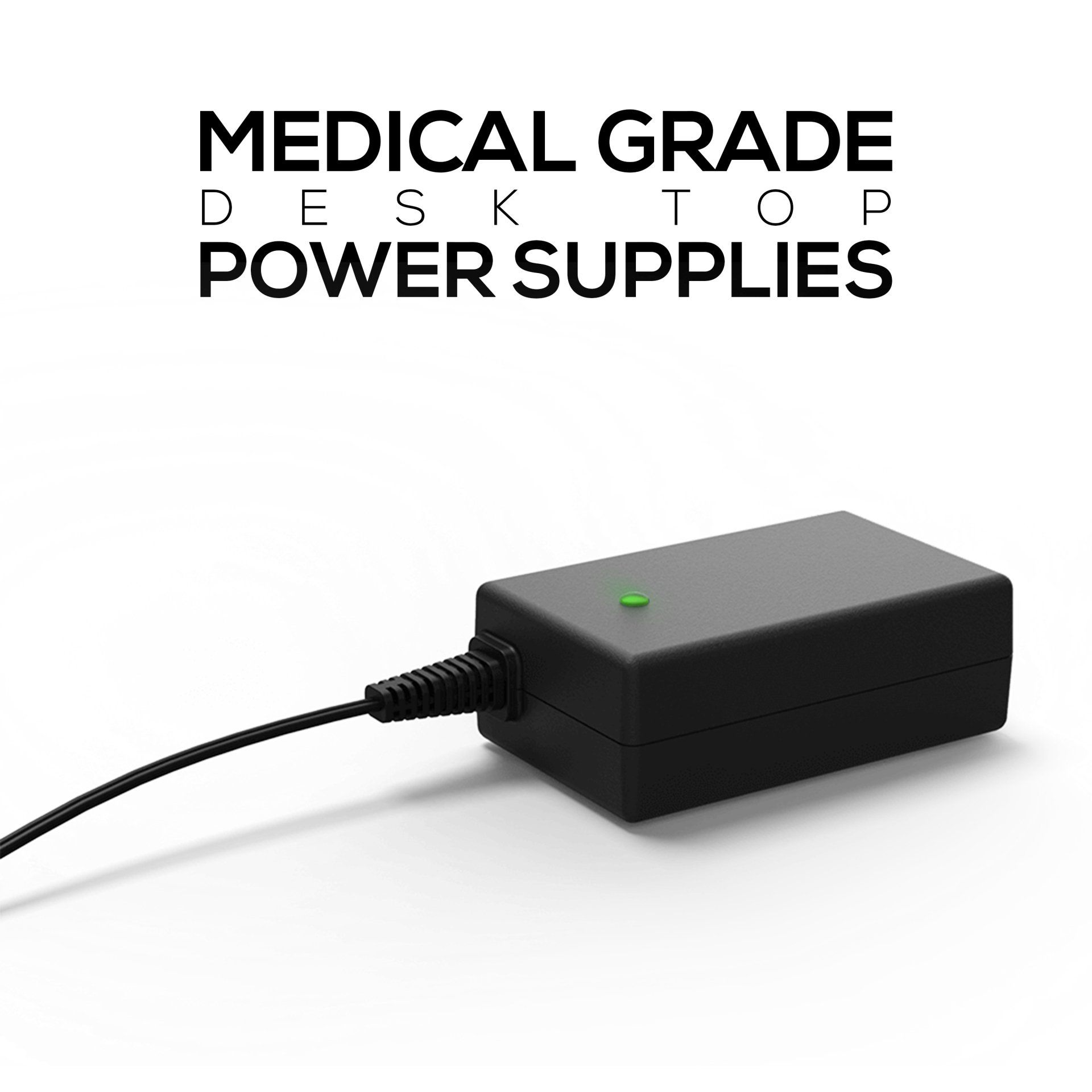 A black desktop power supply with a green light on it is sitting on a white surface.