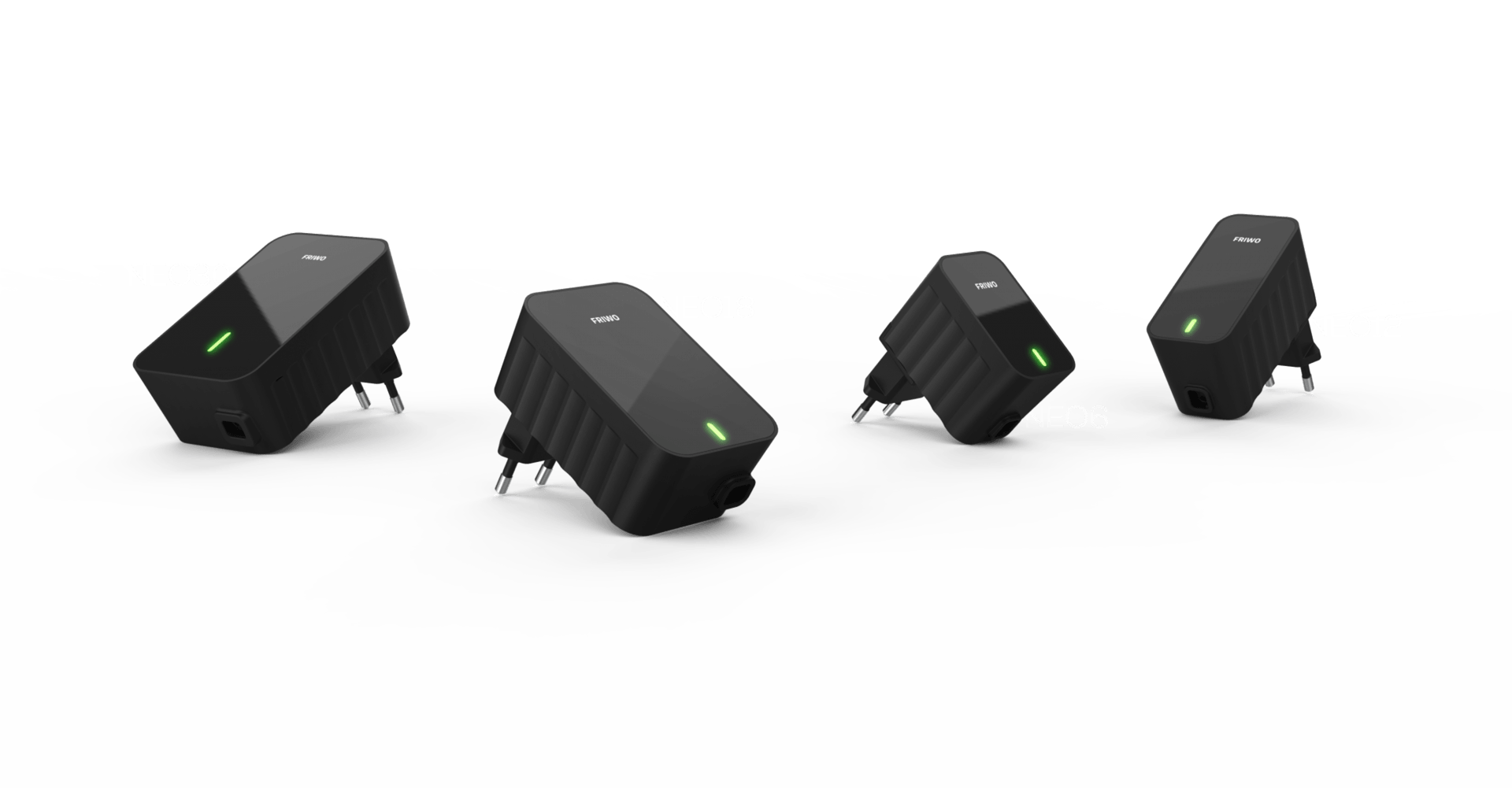 Four black power supplies with green lights on them on a white background