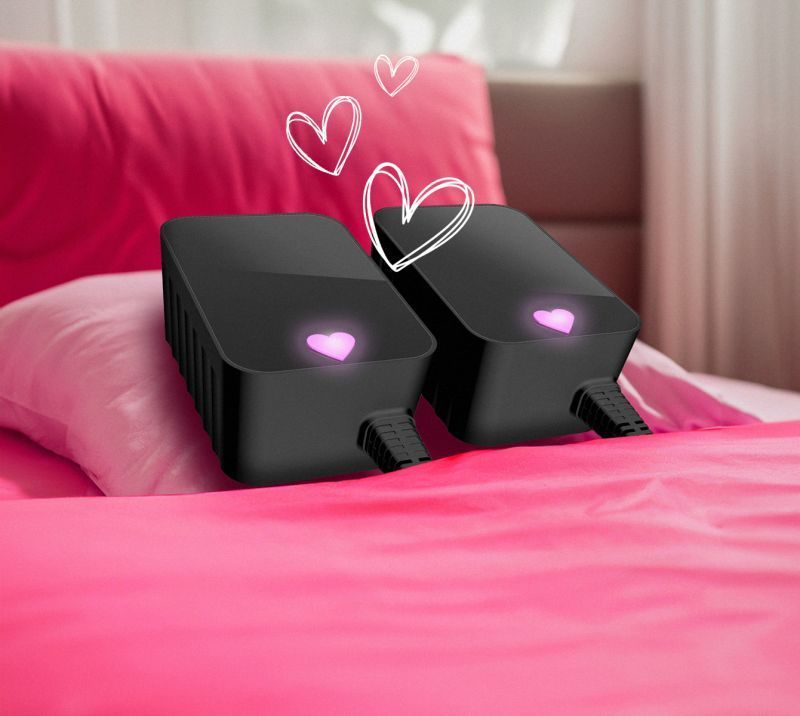 Two Neo power supplies in bed with heart logos