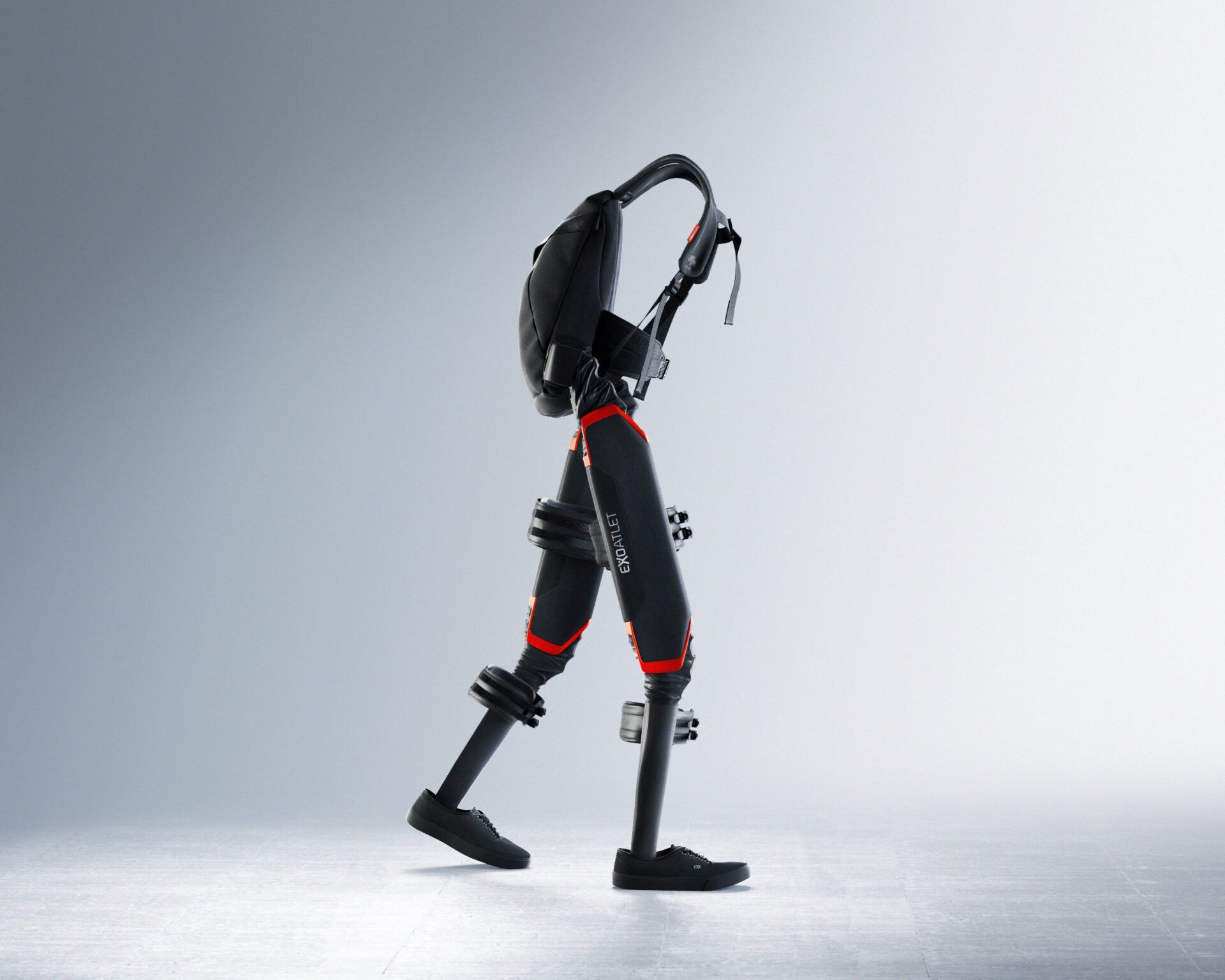 A robot exoskeleton is walking with a backpack on its back.