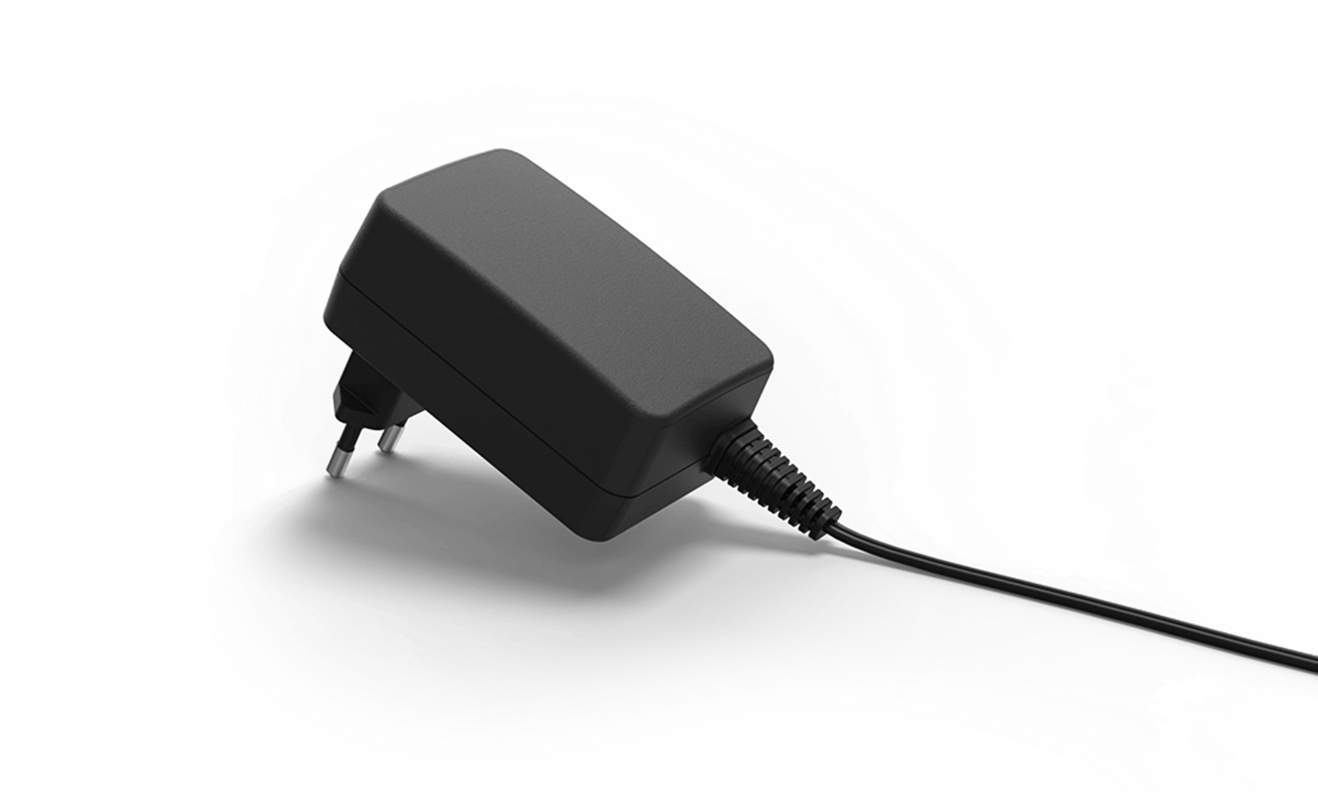 A black power supply with a cord attached to it on a white background.