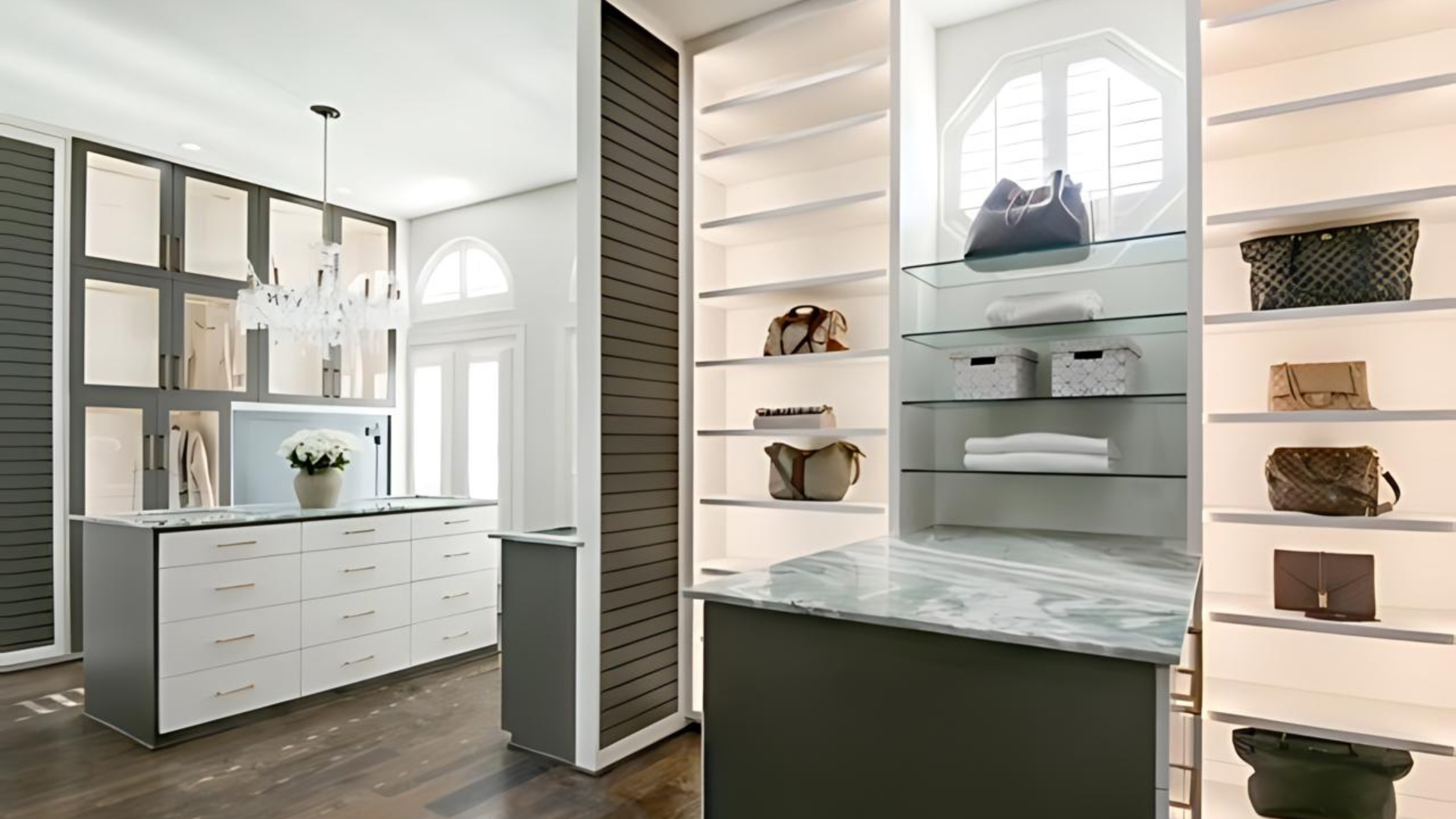 A kitchen and a walk in closet with shelves filled with handbags.