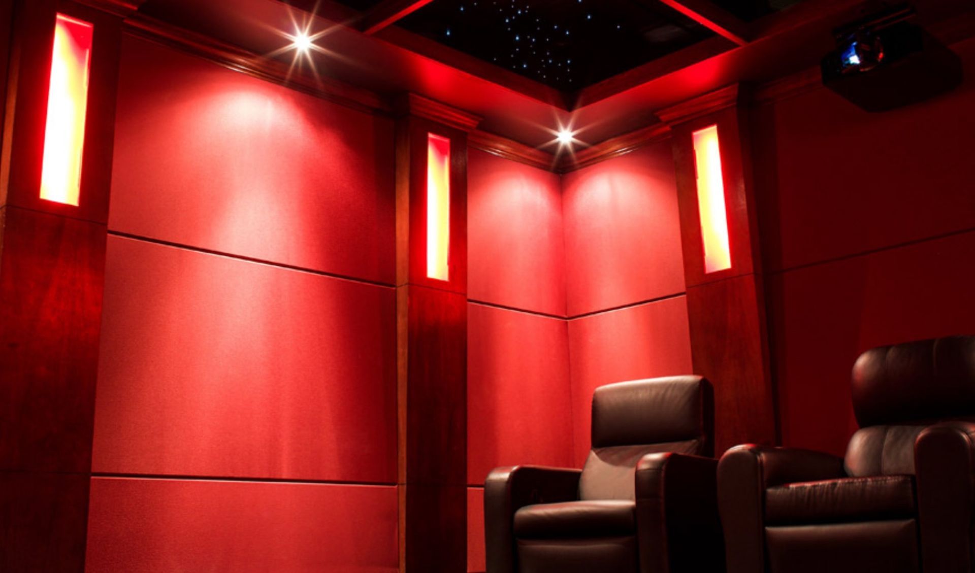 A living room with a couch and a projector screen