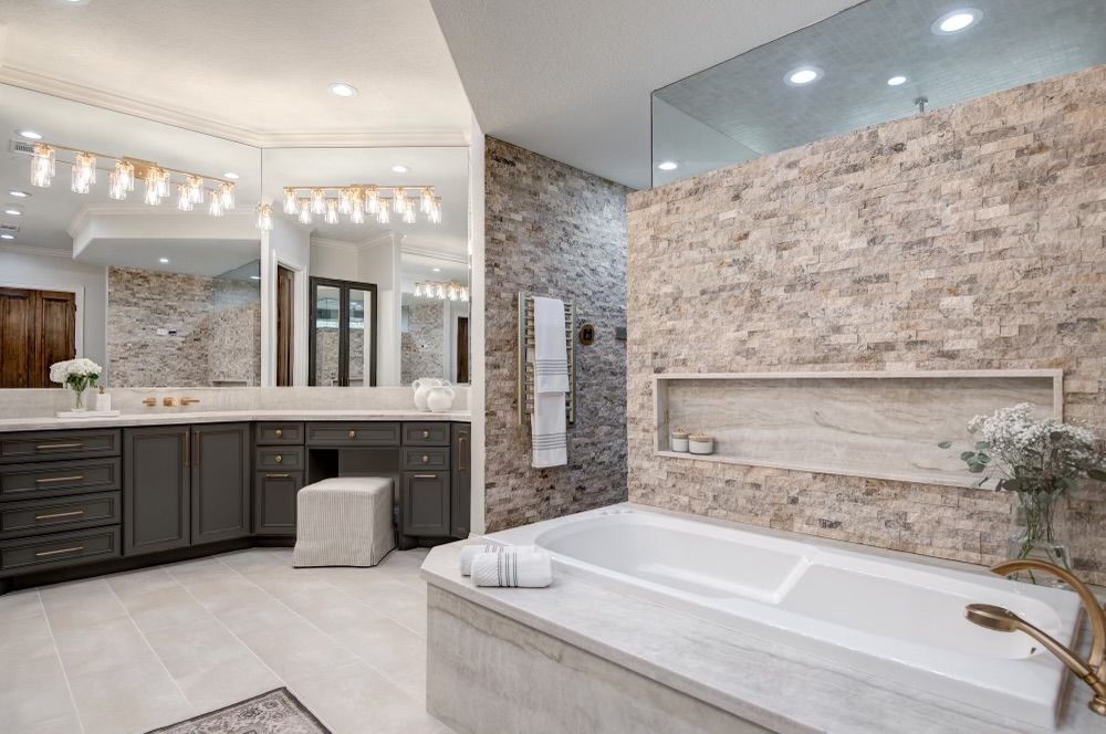 A bathroom with a bathtub and a walk in shower.