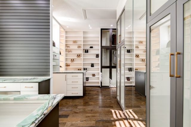 A kitchen with a lot of shelves and cabinets