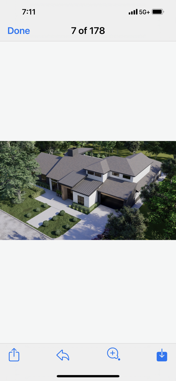 An aerial view of a house on a cell phone.