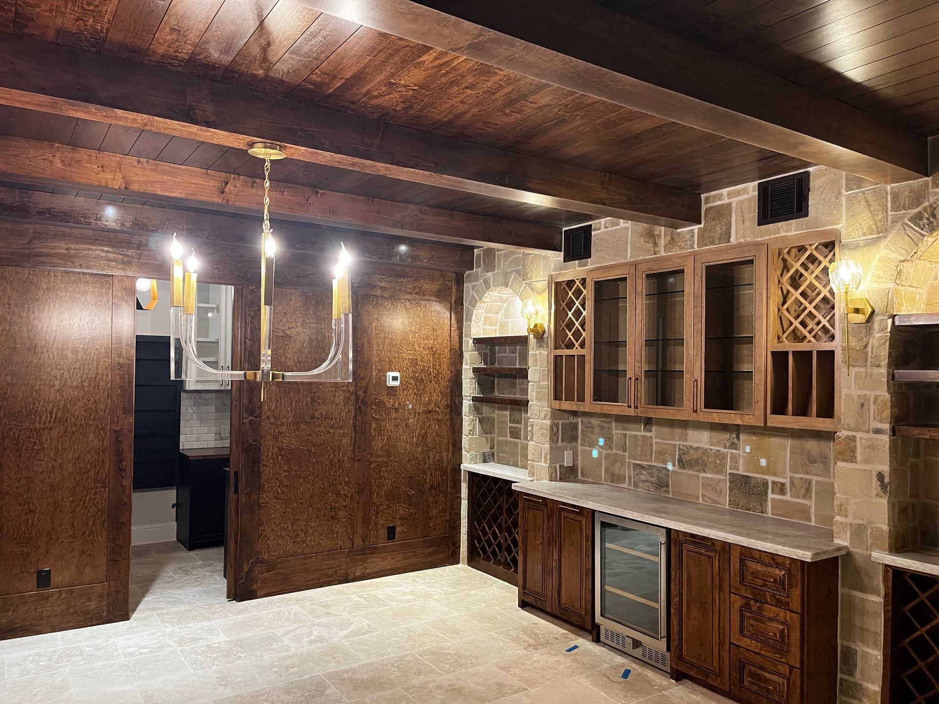 A kitchen with wooden cabinets and a refrigerator.