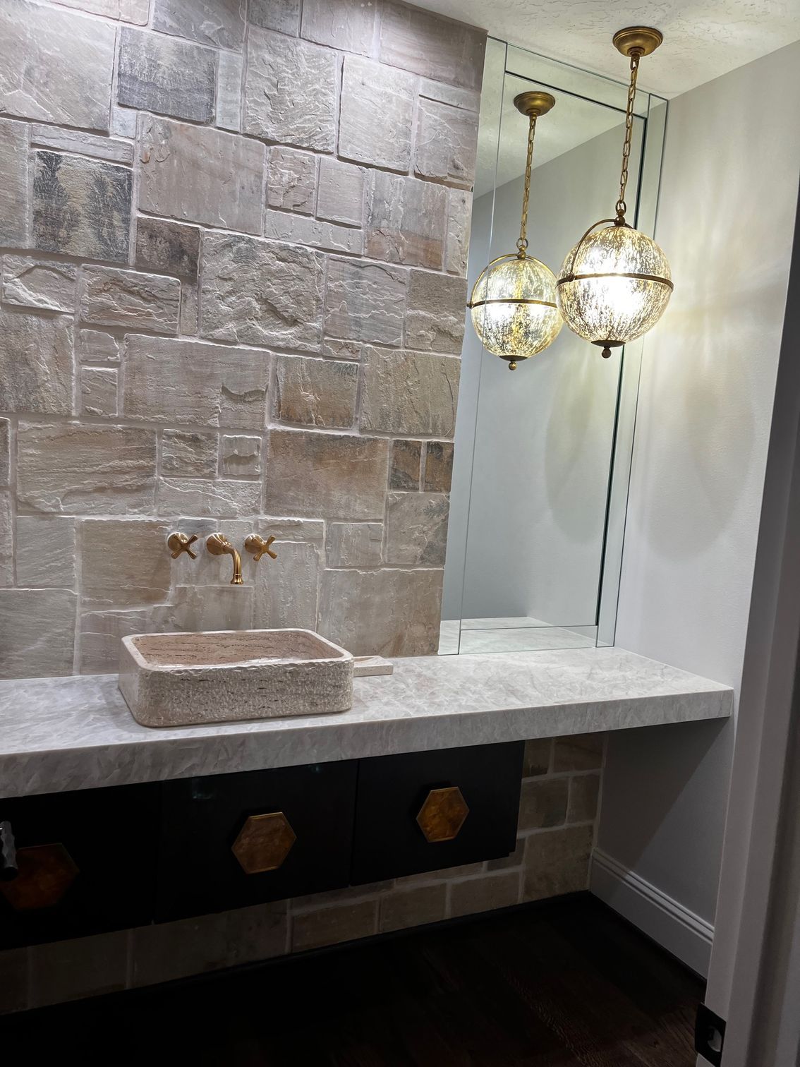 A bathroom with a sink and a mirror