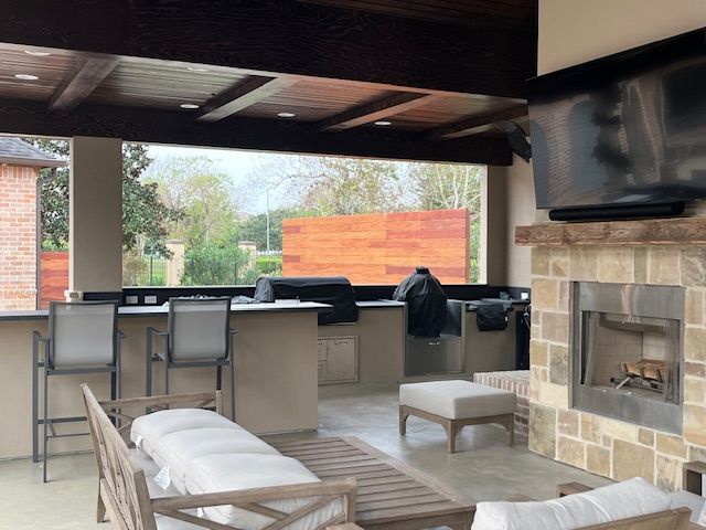 A living room with a fireplace and a flat screen tv