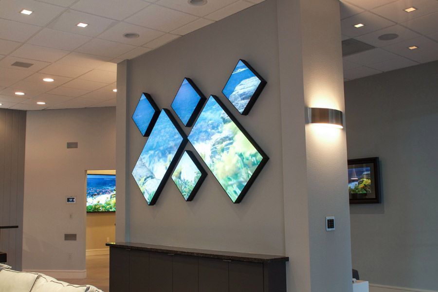 A living room with a couch and a painting on the wall