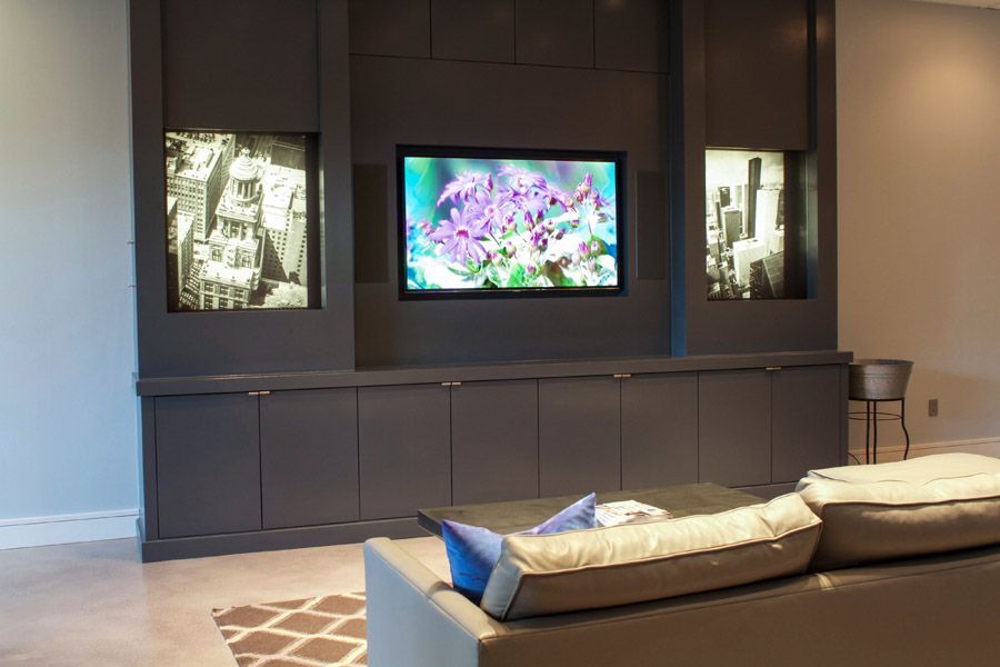 A living room with a couch and a flat screen tv