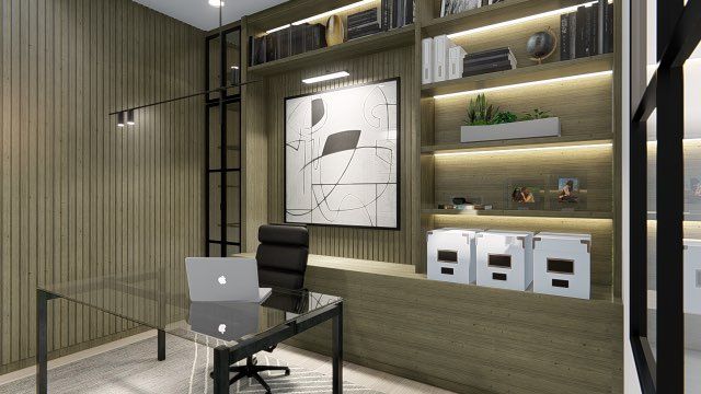 A home office with a desk , chair , laptop and shelves.