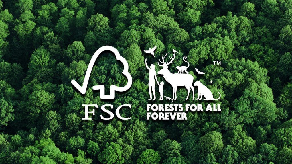 An aerial view of a forest with a logo for fsc forests for all forever.
