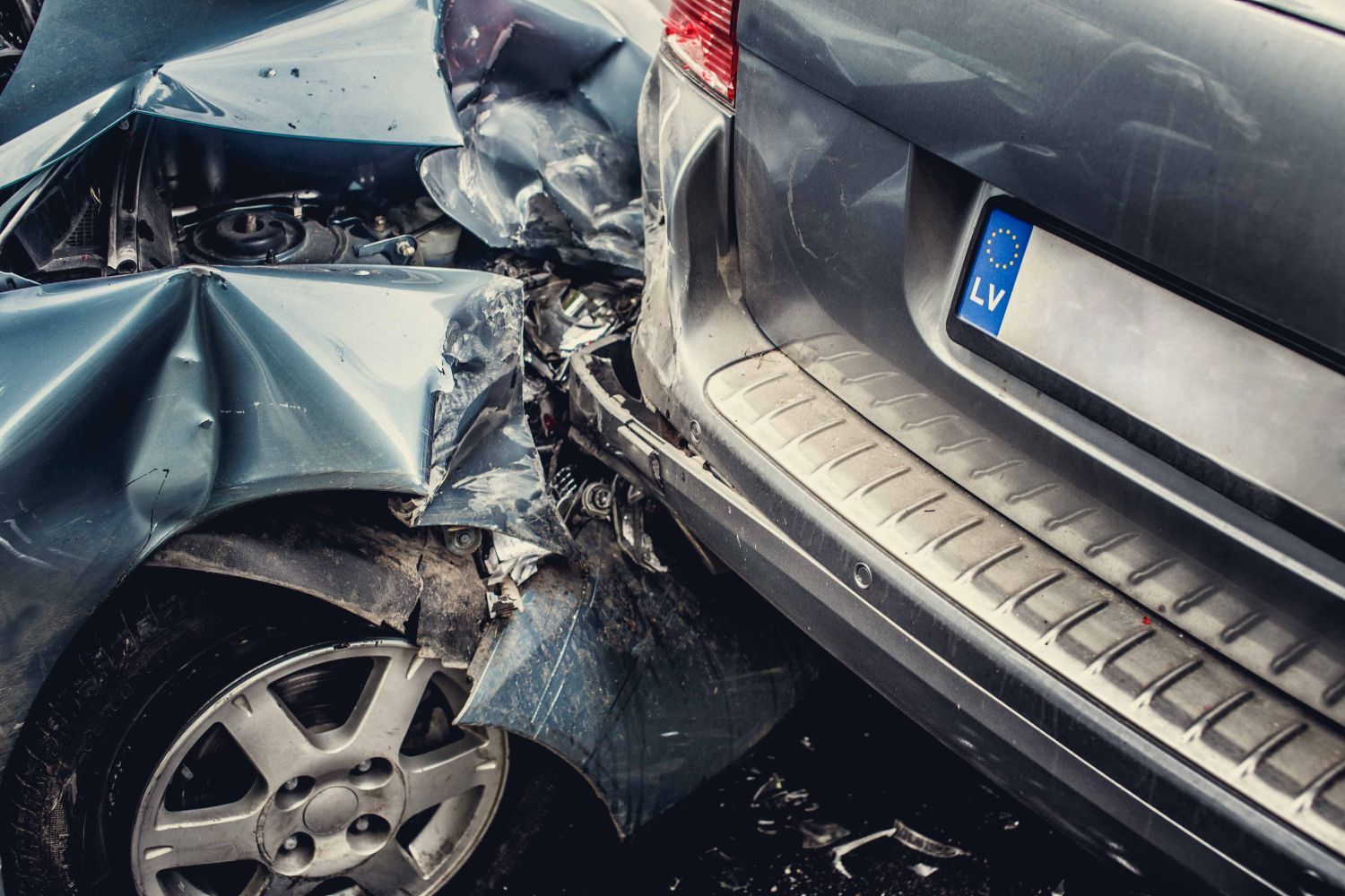 Two cars are involved in a car accident.