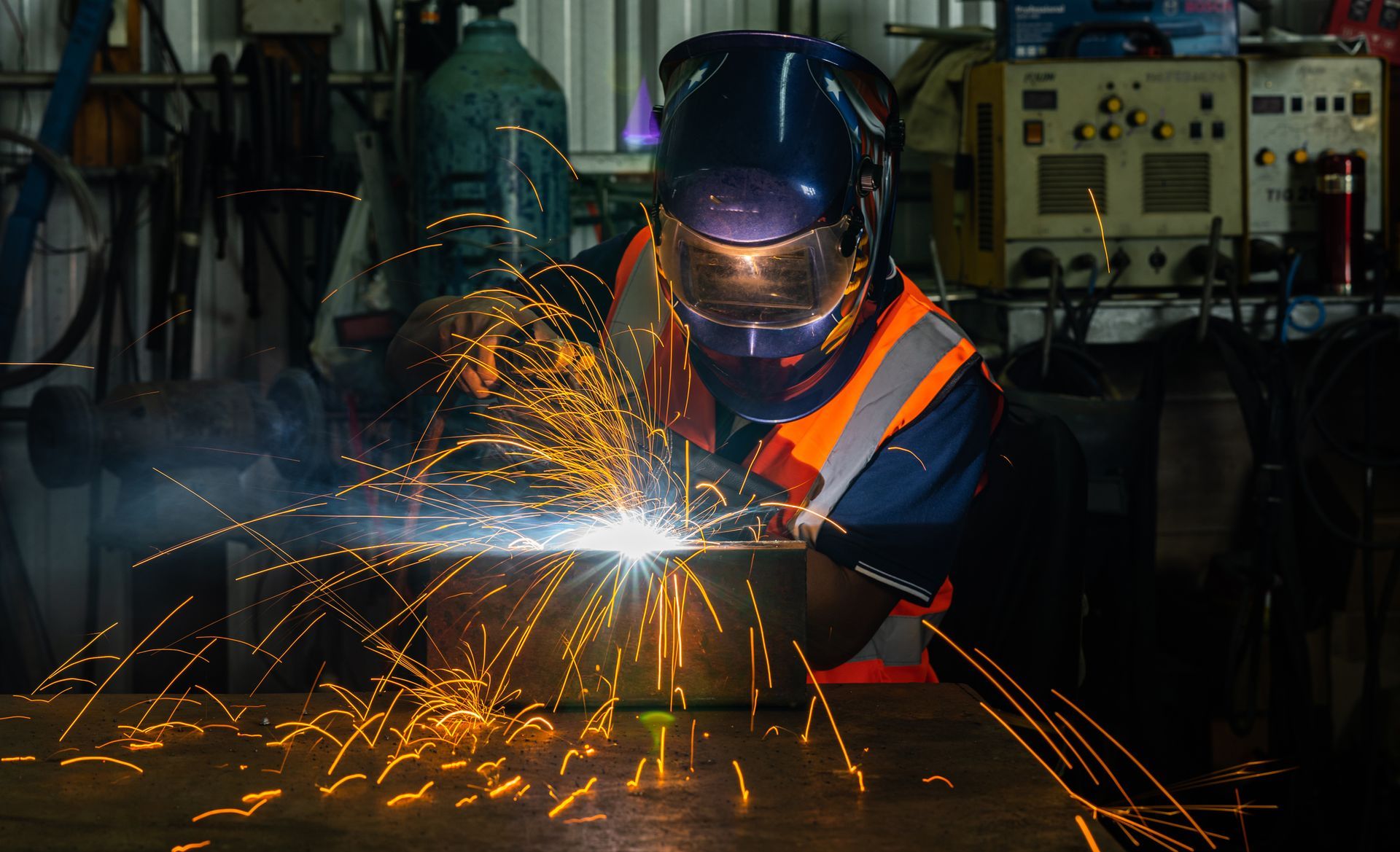 Industrial Welder Working At Workshop - Minot Bay, ND - JN Fabrication & Repair LLC