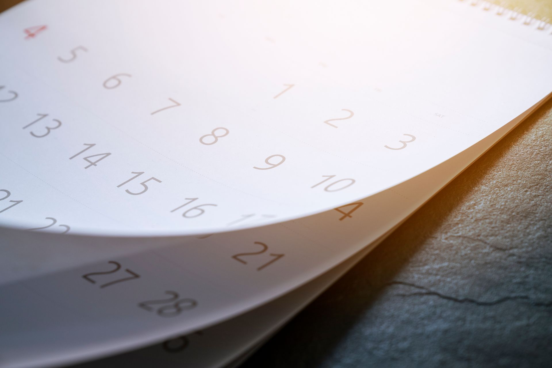 A close up of a calendar on a table.