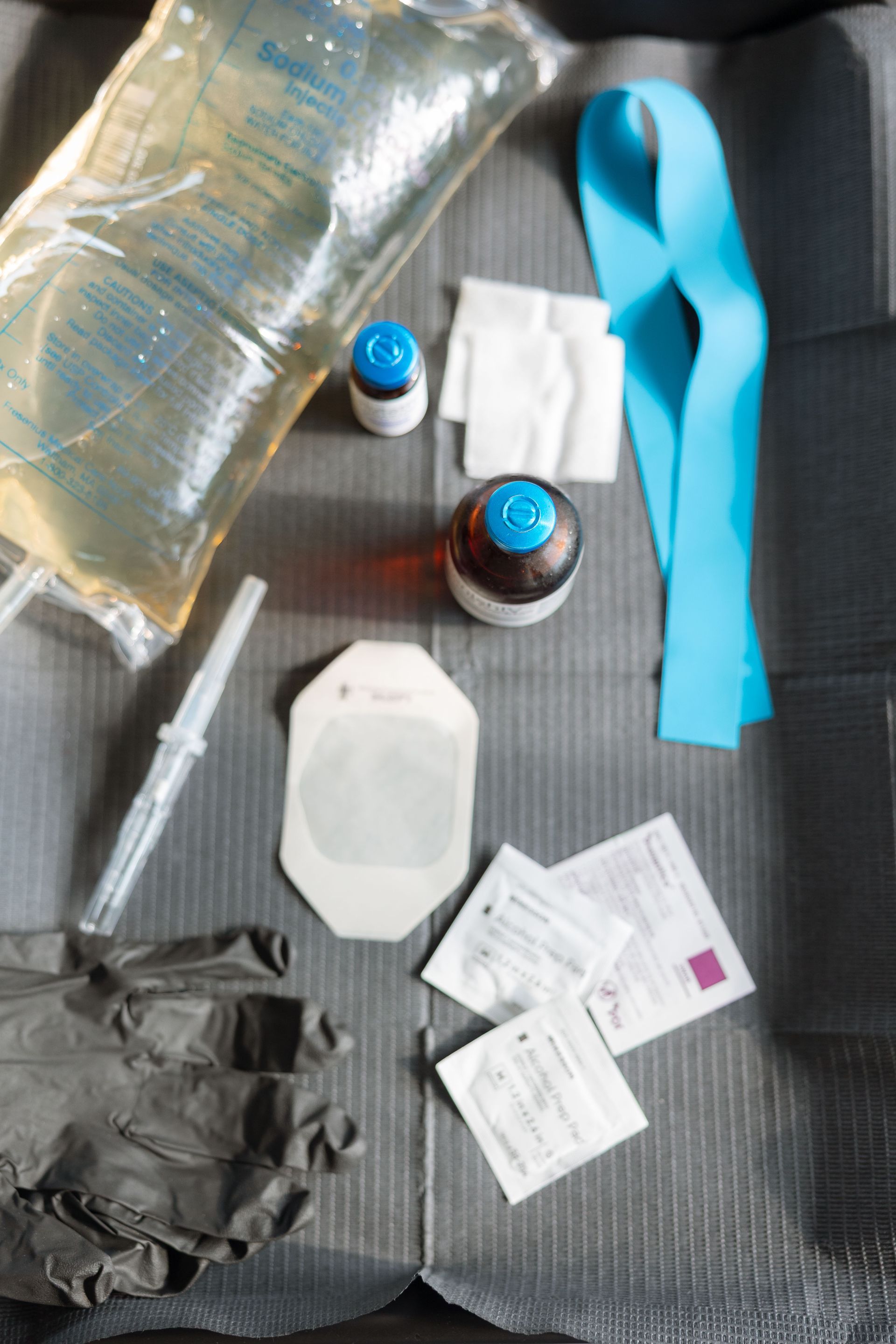 A doctor 's office with a chair and a window.