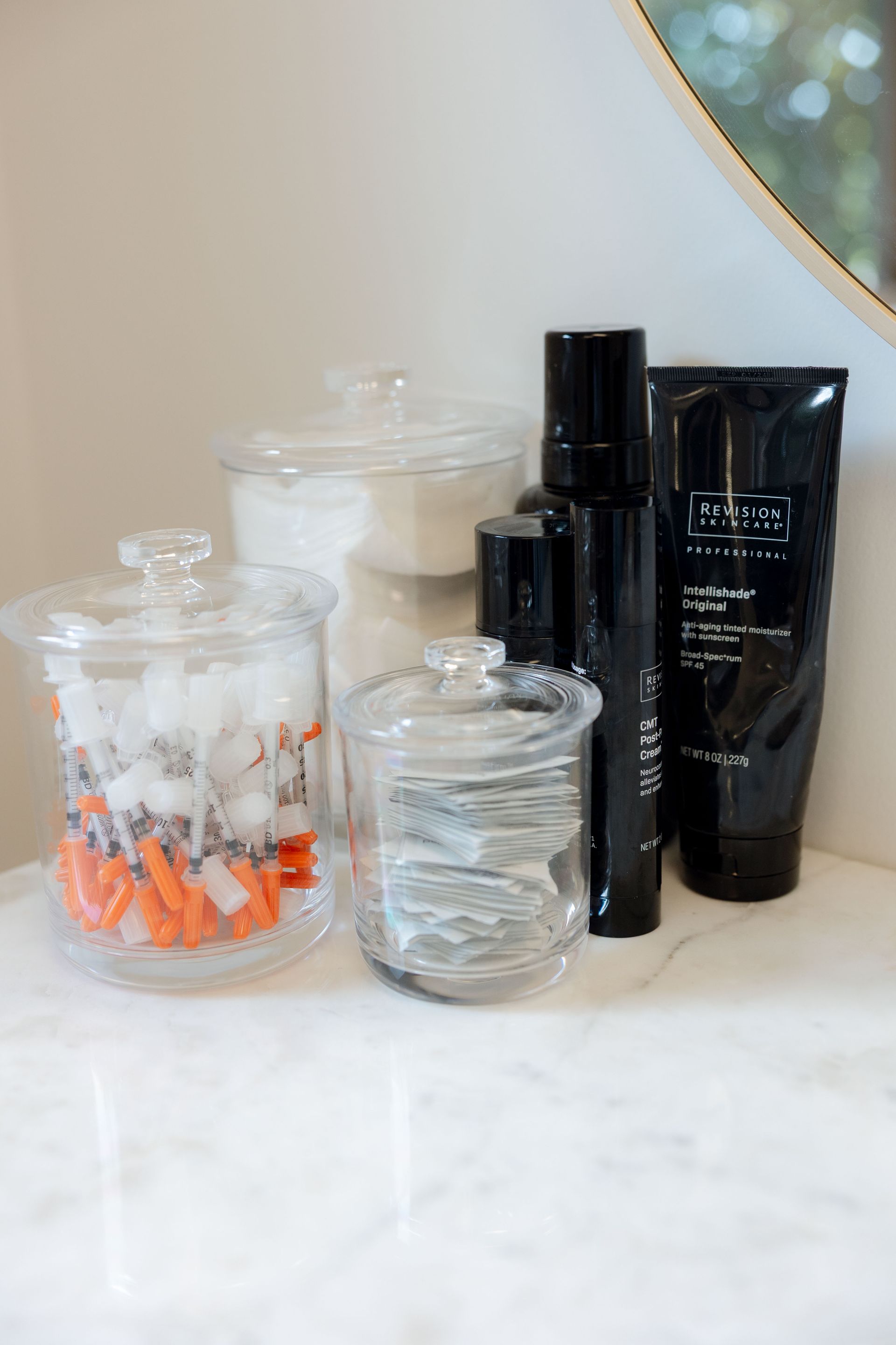 A close up of a dropper with liquid coming out of it on a person 's arm.