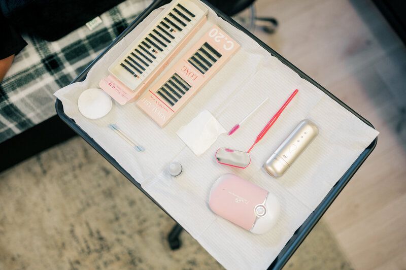 A tray with a bunch of makeup products on it.