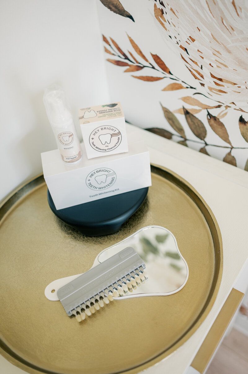 A tray with a brush and a bottle of lotion on it.