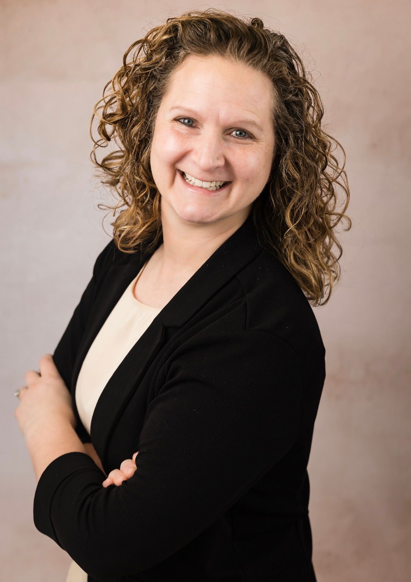 Silhouette of a person with a round head and a curved body against a gray background.