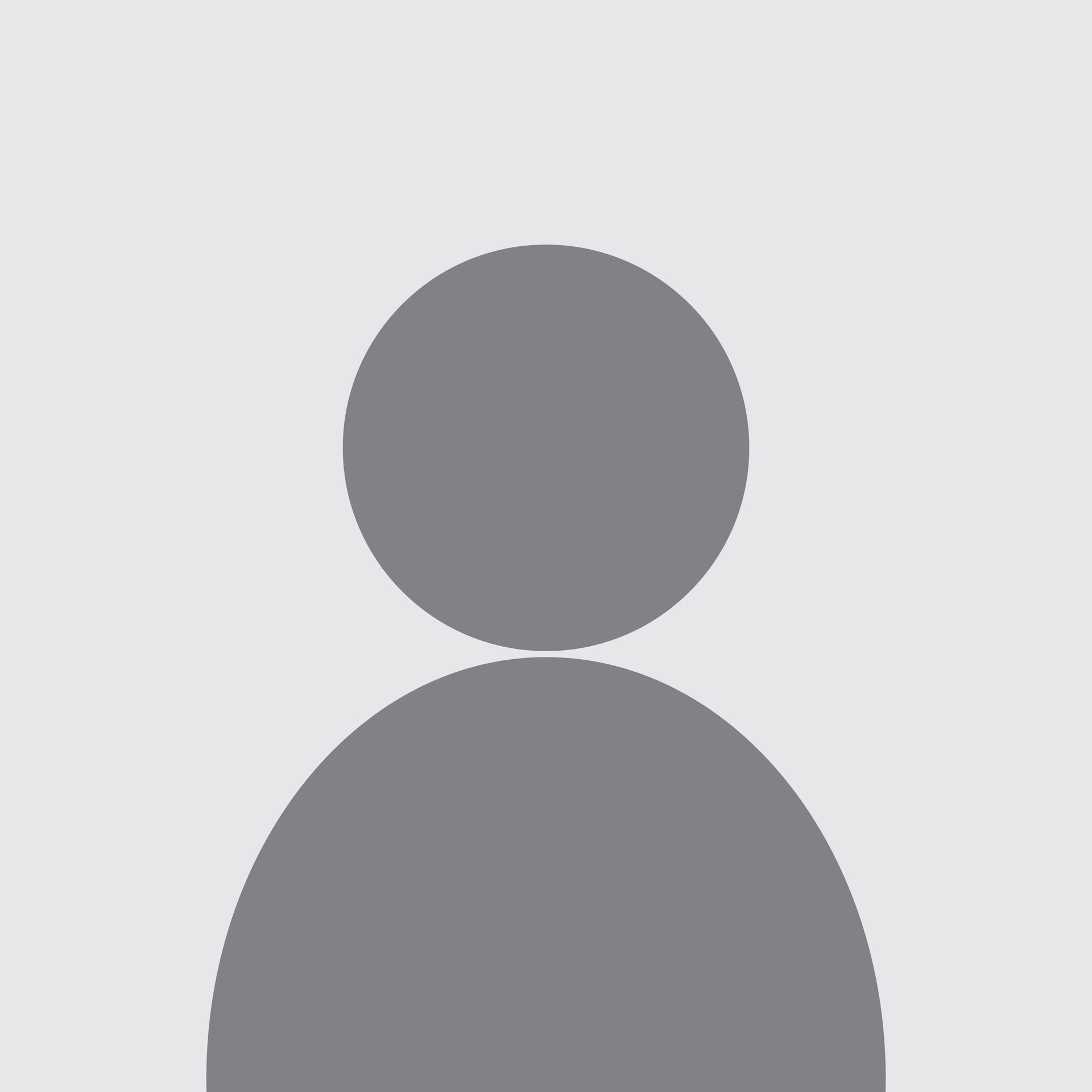 Silhouette of a person with a round head and a curved body against a gray background.