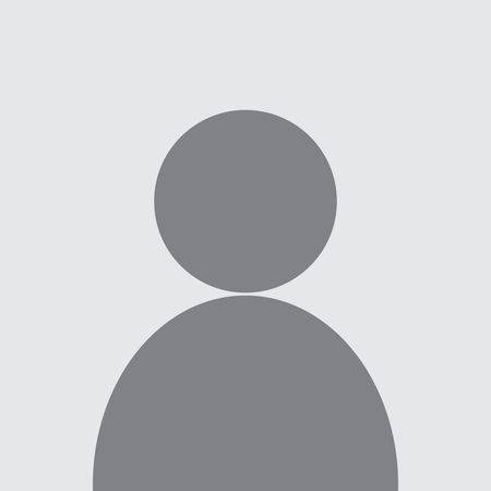 Silhouette of a person with a round head and a curved body against a gray background.