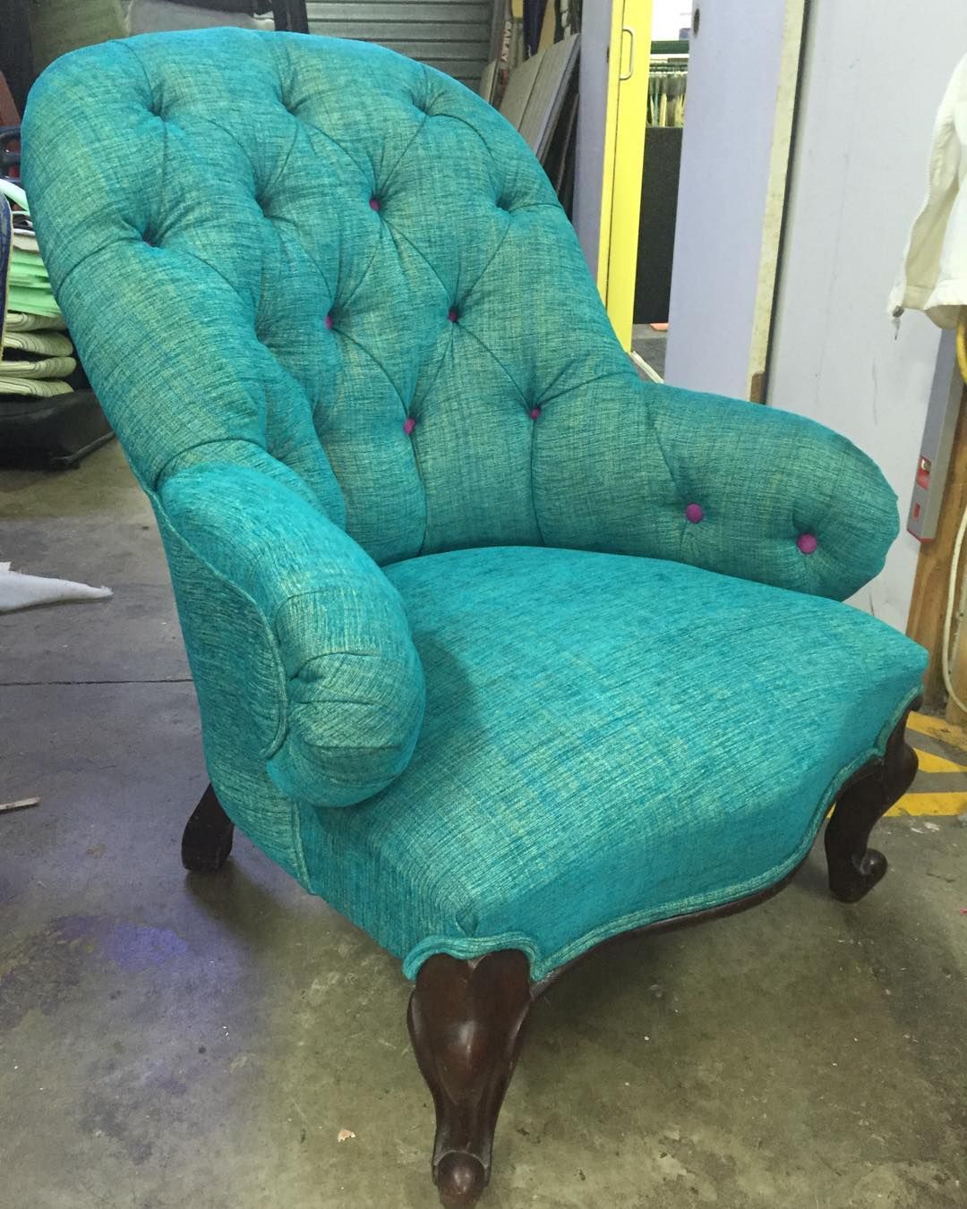 A Turquoise Chair With Pink Buttons on the Arm Rests — Aztak Upholstery In Manunda, QLD