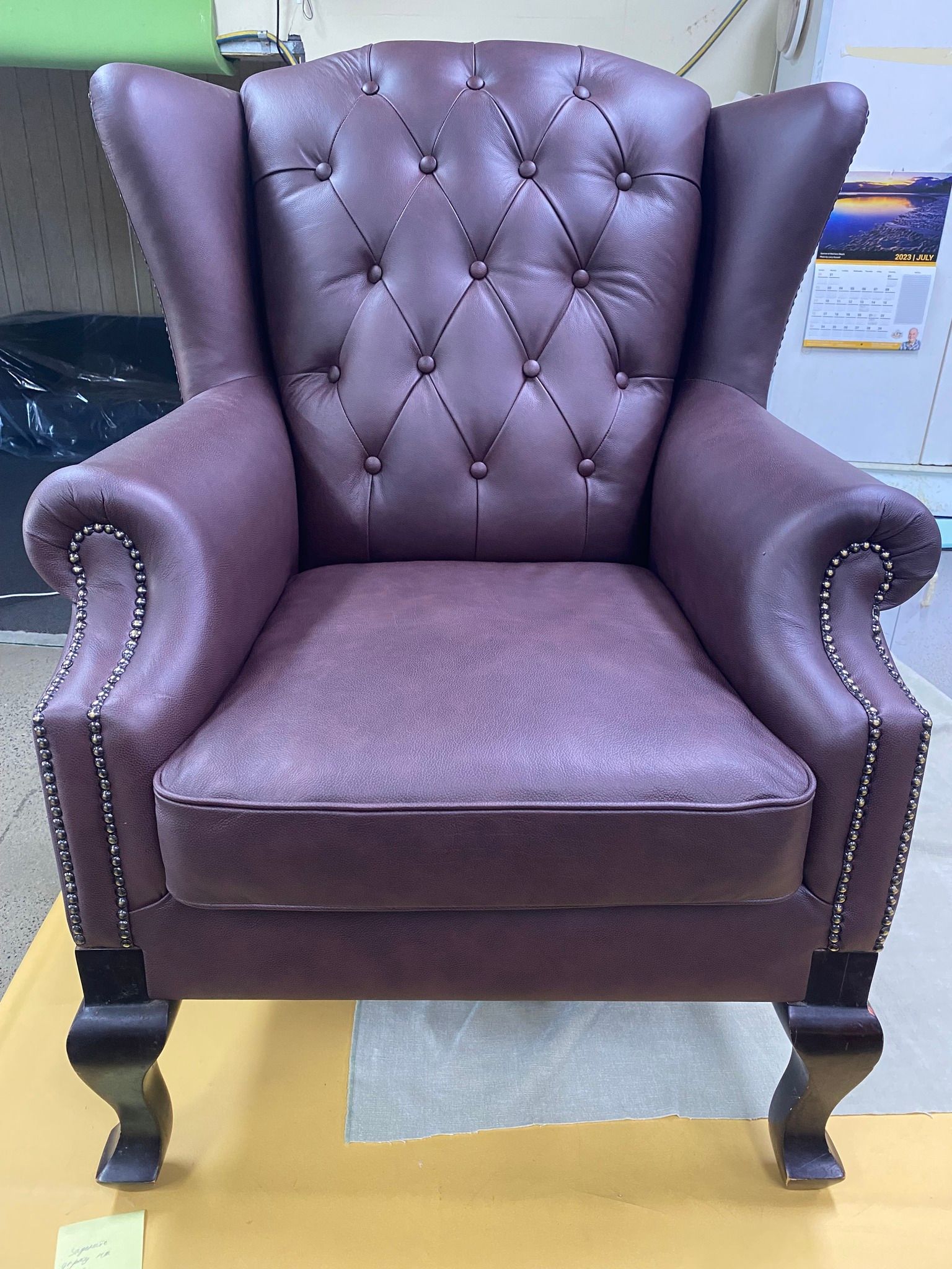 A Purple Leather Chair is Sitting on Top of a Wooden Table — Aztak Upholstery In Manunda, QLD