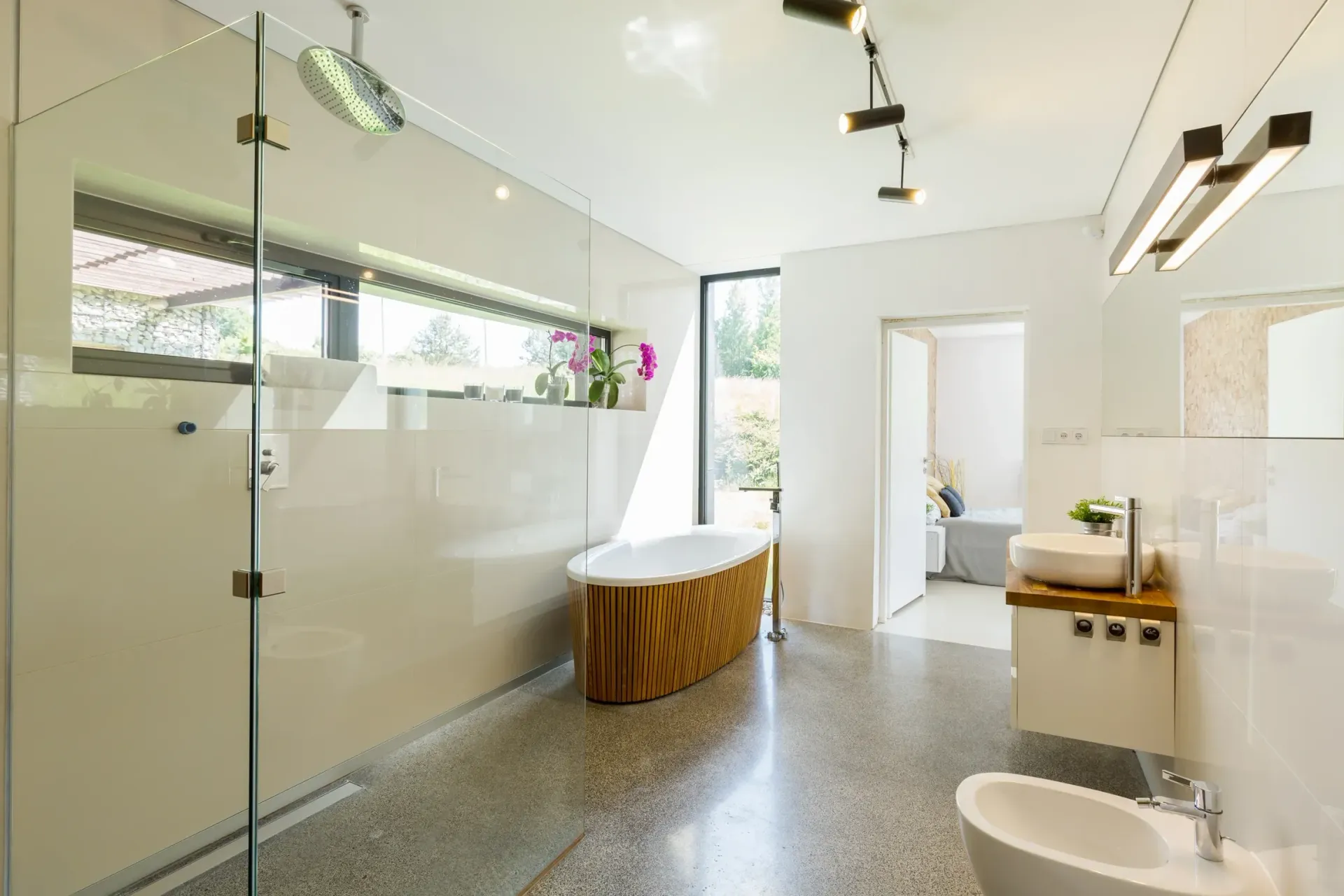 a bathroom with a bathtub , sink , and bidet .