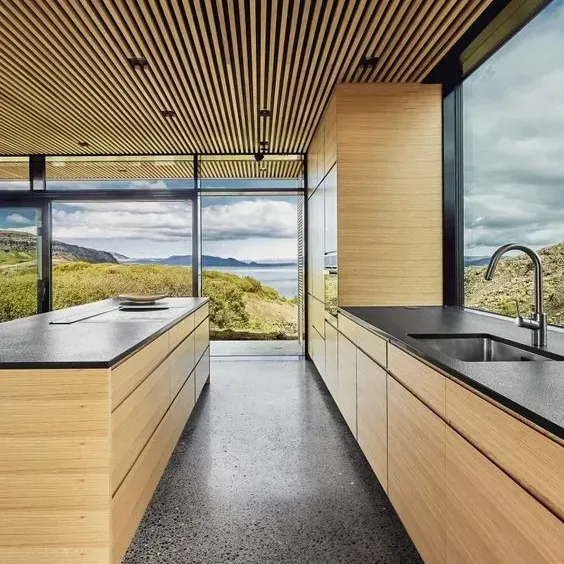 a kitchen with a large island and a sink