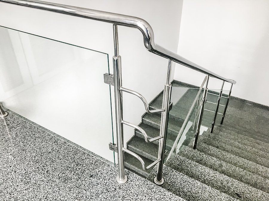 marbled type stairs with stainless handrails