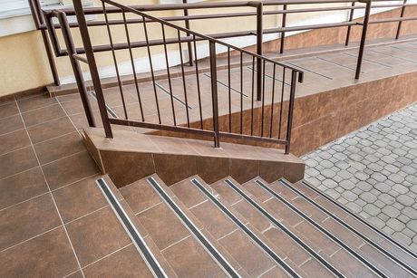 a stairs with brown tiles