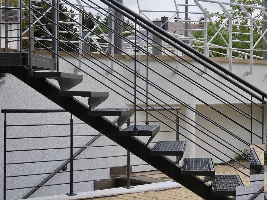 a metal stairs with metal handrails
