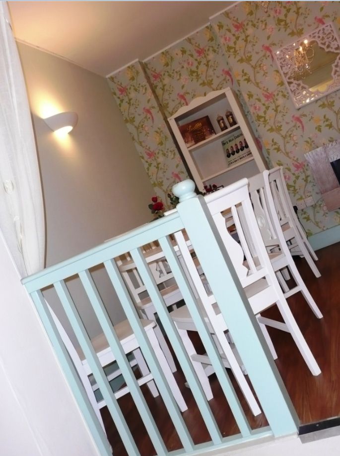 cafe interior with chairs at a rakish angle