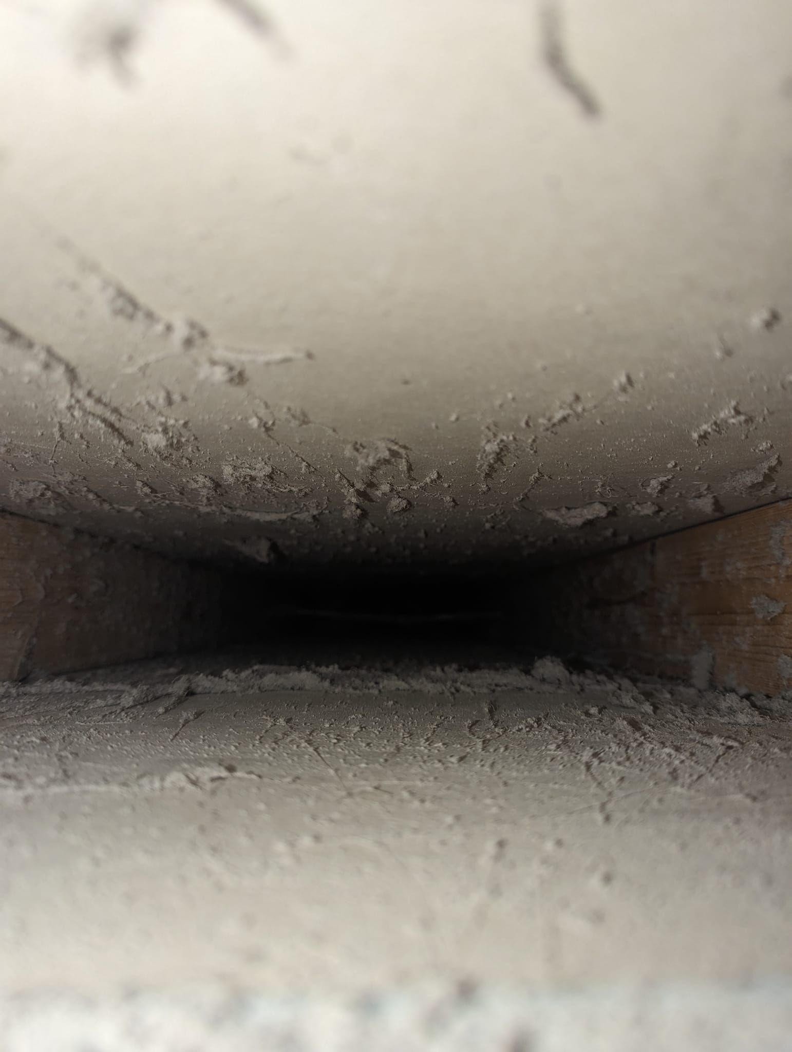 A close up of a hole in the ceiling of a building.