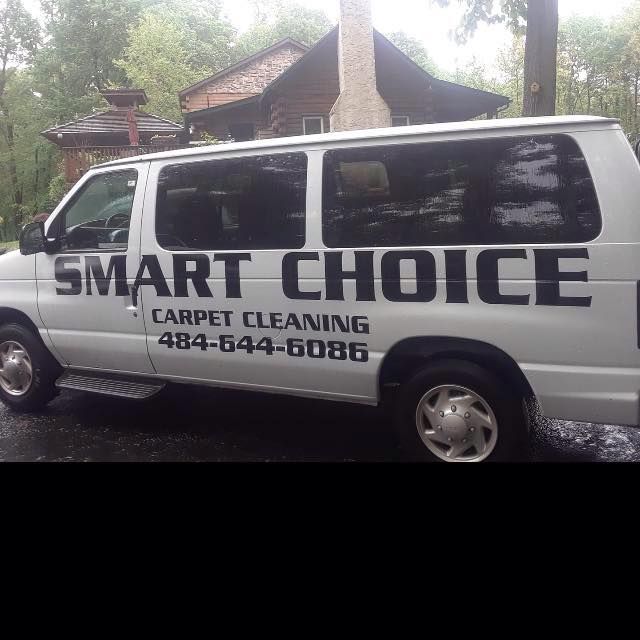 A white van with the words smart choice carpet cleaning written on it.