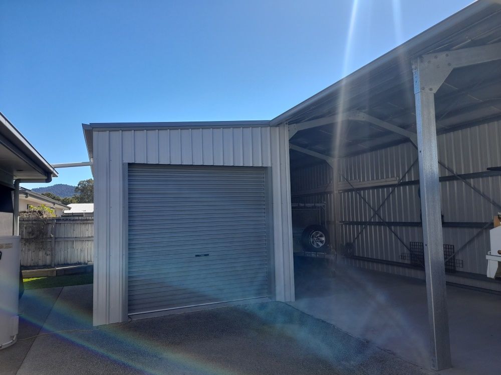 A Car Is Parked In A Garage Under A Canopy — Whit Coast Sheds in  Gregory River, QLD