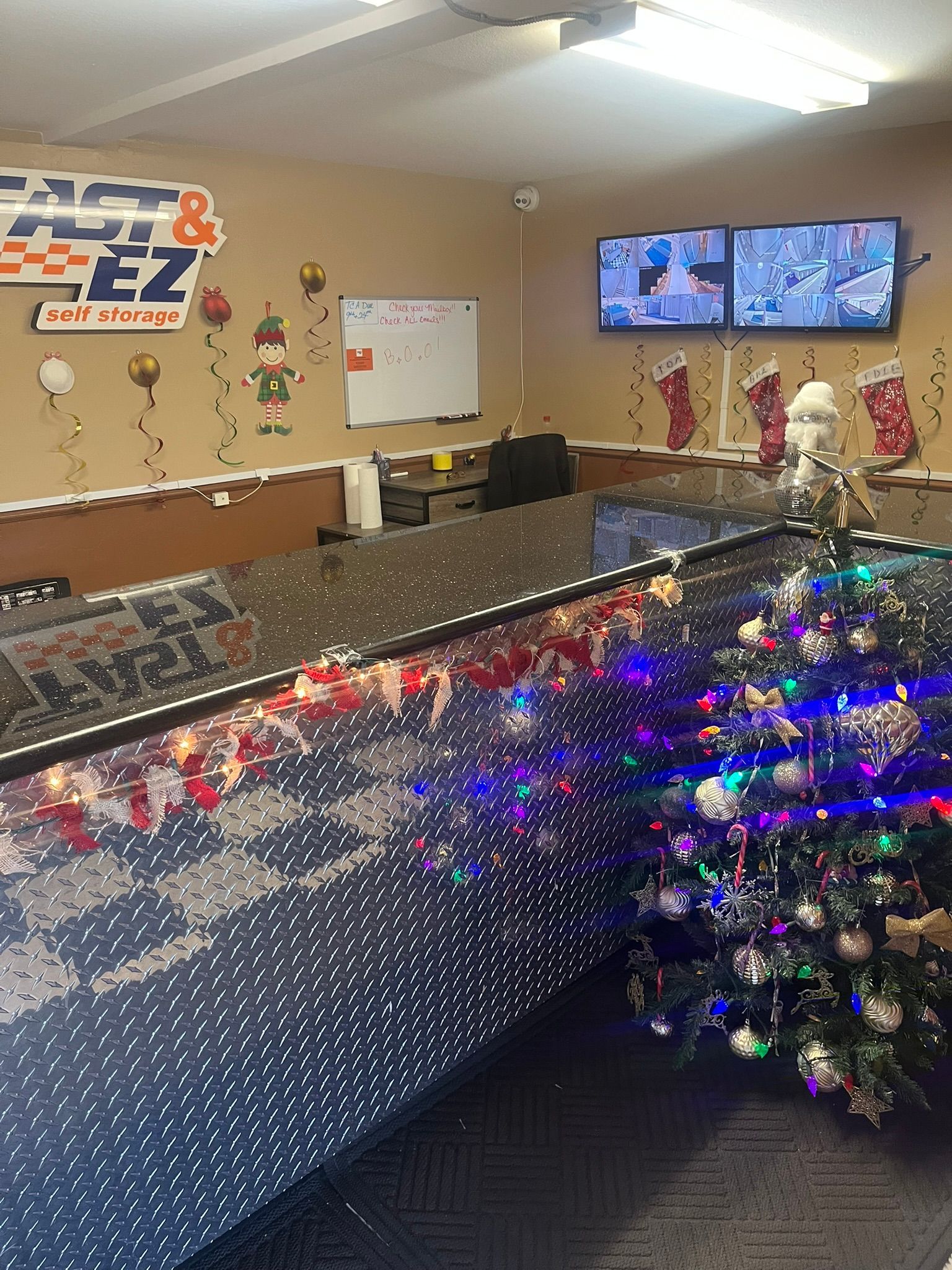 There is a christmas tree in the middle of the room.