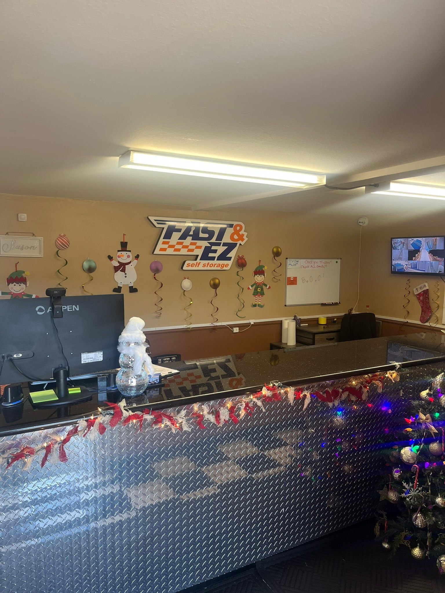 There is a christmas tree in the middle of the room.