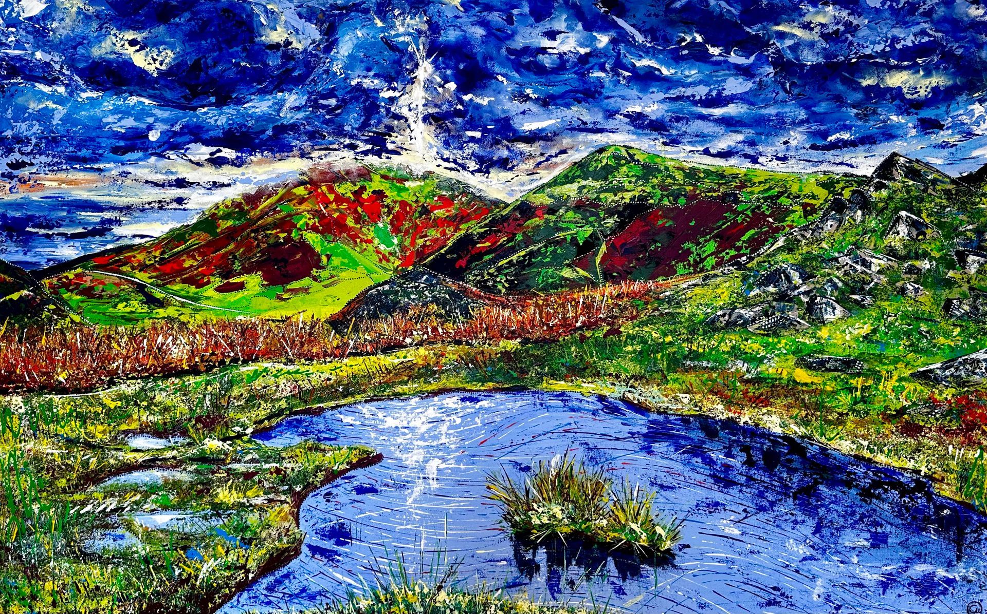 Large contemporary painting of Loughrigg Fell in The Lake District England, painted with my fingers and including inspiration of Aboriginal dot art, encapsulating the spiritual aspect of nature within art. Vivid colours painted with pallet knife.
Alectrona, the goddess of the Sun. She rises beyond Loughrigg Fell in The Lake District, illuminating the surrounding natural beauty from high above the clouds, light crackling through the darkness between us, mirrors reflect time, beauty and strength in pools of dreams below. A stunning walk from Elterwater which we as a family regularly walk when in The Lakes. Every time, I stop at this point and allow the vastness of my surroundings to take me in. Quiet, still, wild, vibrating and dense under foot. Feeling so connected to our Earth and all that makes it real.