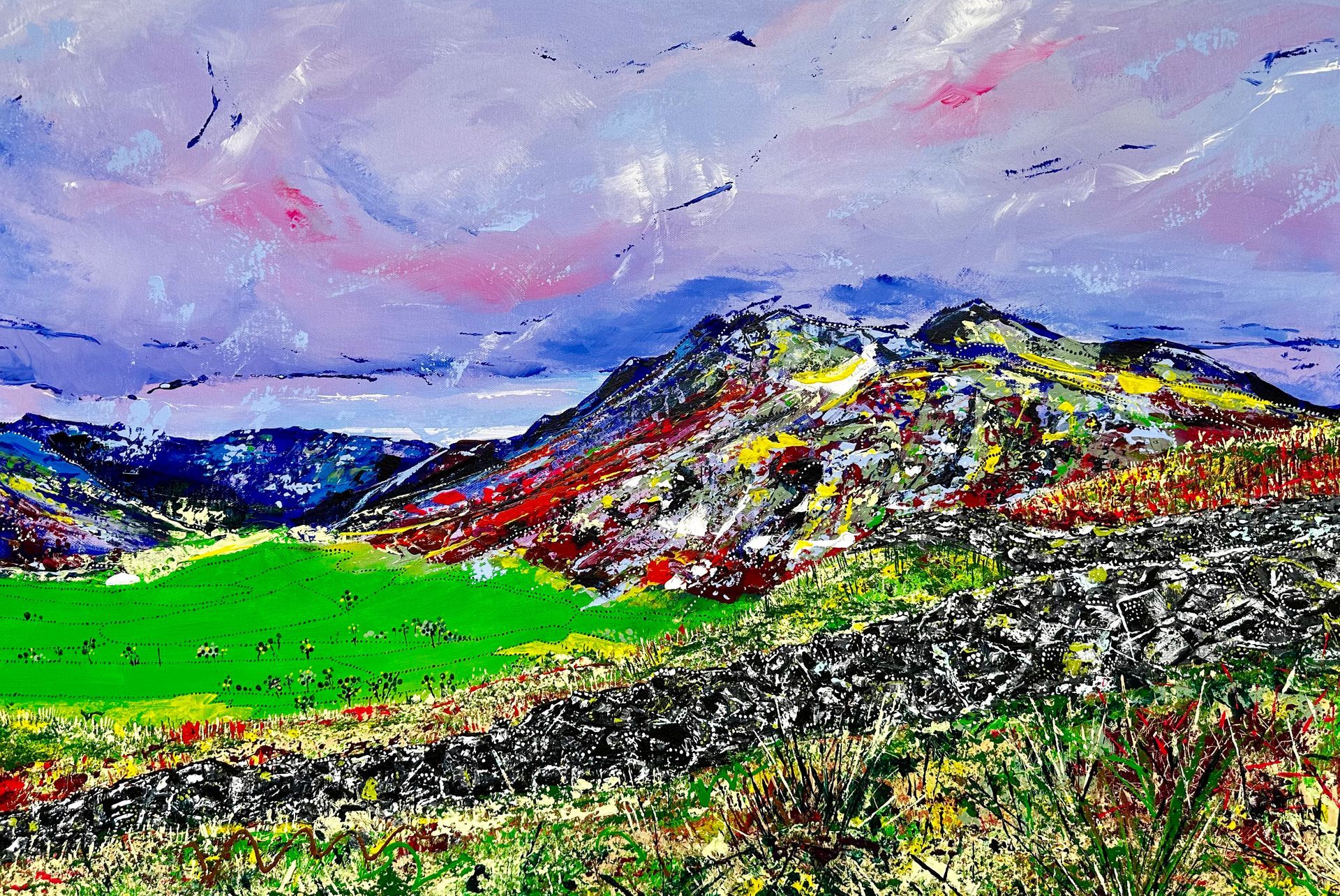 Large contemporary painting of the Langdales in The Lake District England, painted with my fingers and including inspiration of Aboriginal dot art, encapsulating the spiritual aspect of nature within art and the history of dry stone walls. Vivid colours painted with pallet knife.
“Roll n’ Rock” is a vibrant representation of the rolling landscape in the Lake District and the many meandering dry stone walls which depict the interaction between family, history and ownership with the landscape. I find the rocks of the dry stone walls so tactile, and I imagine the many stories these walls could share if they could speak. They are completely part of the landscape, running like veins through the land. Together, the rolling landscape and rocky walls hold stories of time and the slow evolution of our this wild natural world.