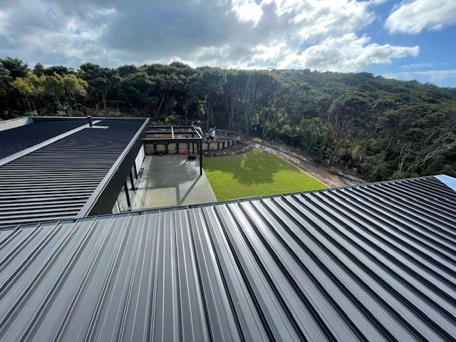 The Roof of a House with a View of a Lush Green Field — Auckland, NZ — Pro Roofing