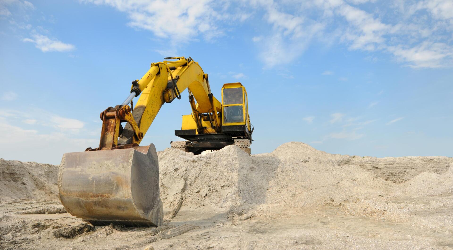 excavator removing trees and stumps