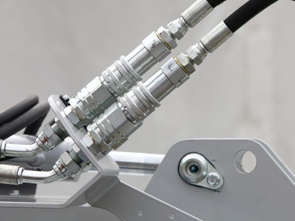 Close-up of Hydraulic Quick-connect Couplings and Hoses — Action Hose & Fitting Solutions In Logan, QLD