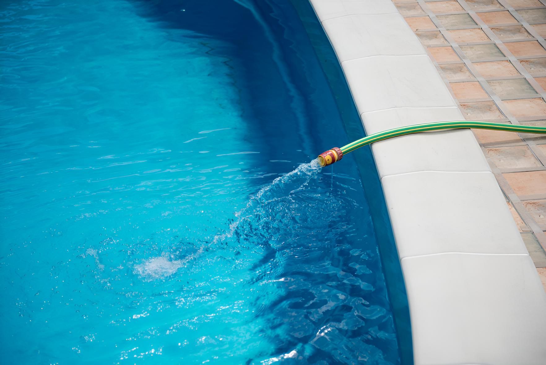 A Green Hose Is Being Used — Action Hose & Fitting Solutions In Brisbane, QLD