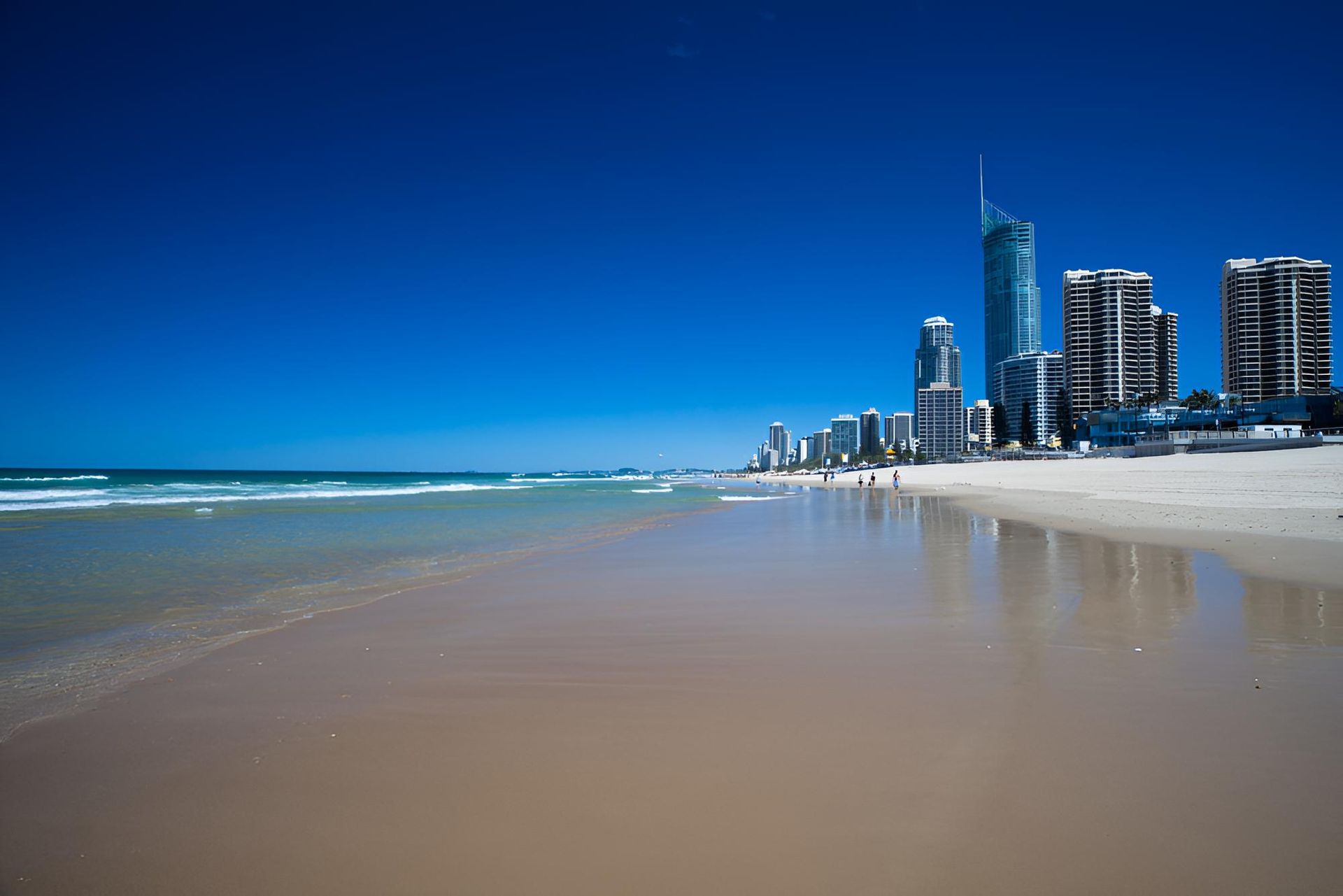 A Beach With A City Skyline — Action Hose & Fitting Solutions In Gold Coast, QLD