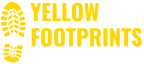 A yellow logo for yellow footprints with a yellow footprint on a white background.