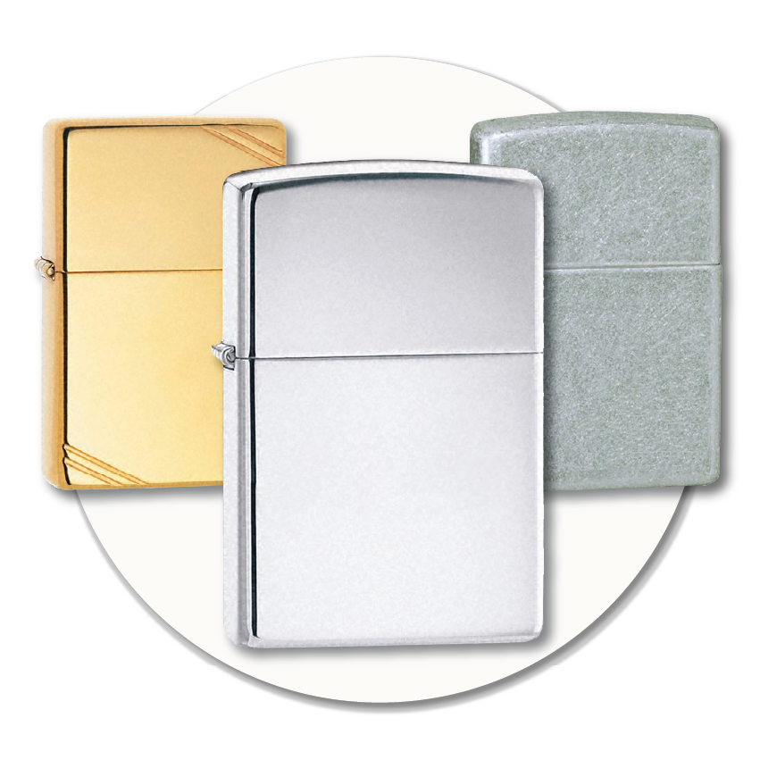 Three classic Zippo lighters in chrome, brass, and brushed chrome finishes displayed against a light circular background, showing the styles available to buy at Sole to Sole.